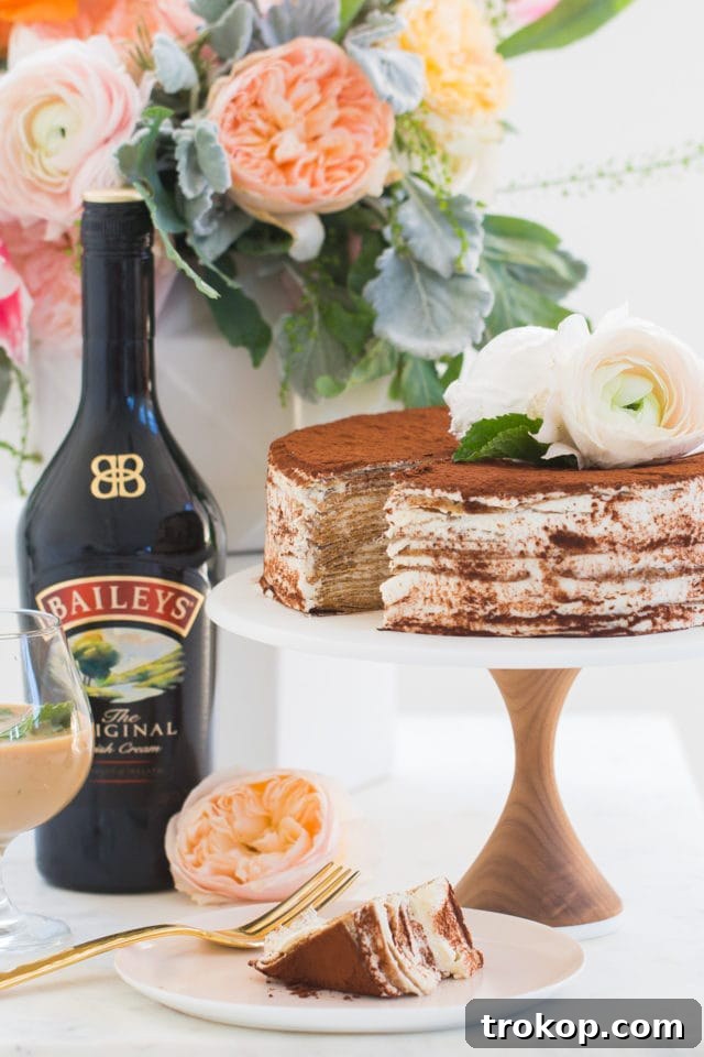 Beautifully garnished Baileys Tiramisu Crepe Cake ready to be served.