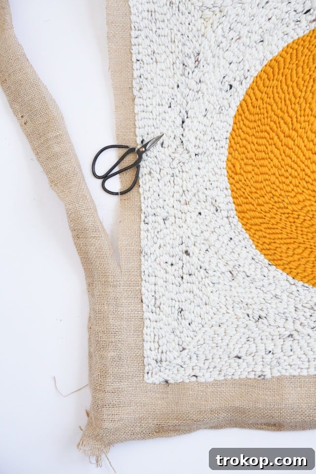 How to Make a Rug Hooked Pillow 15 Step 9: Demonstrating the neat and clean appearance after trimming the yarn, ready for the next color.
