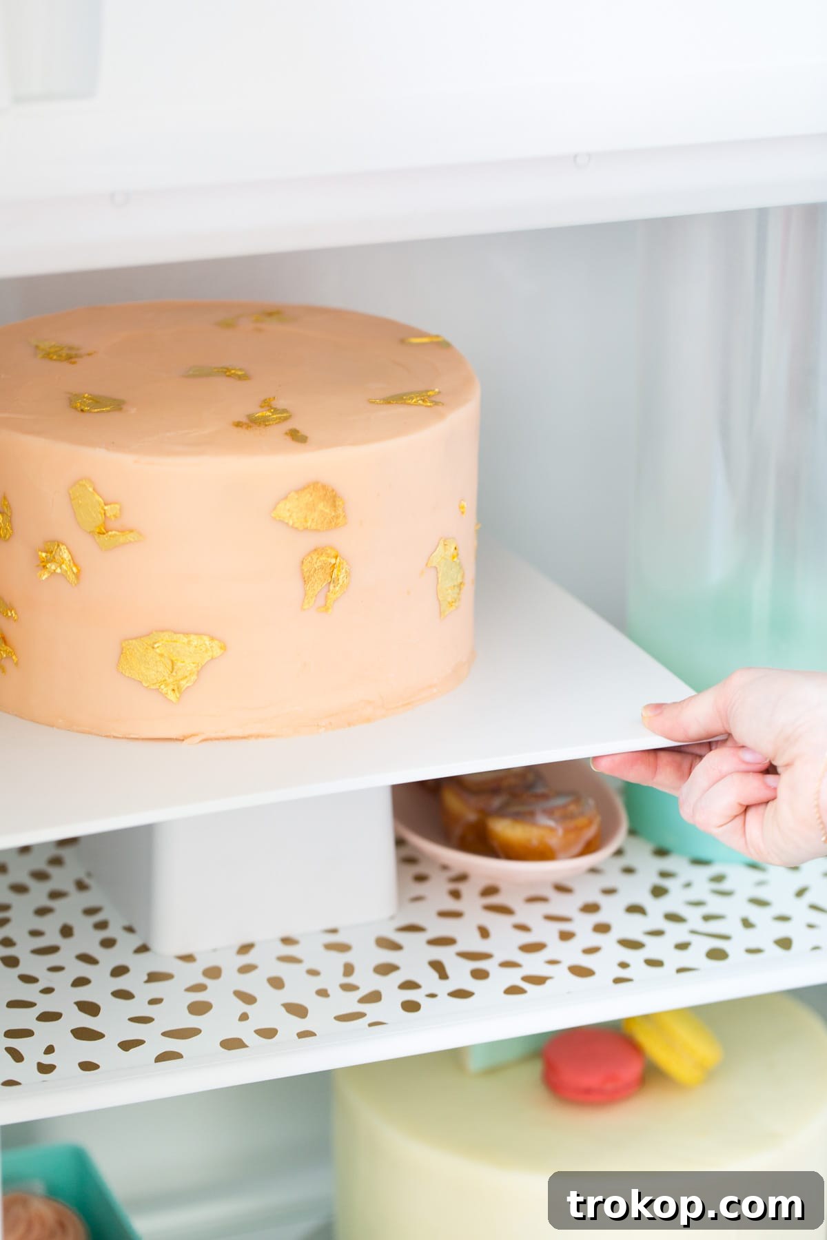 6 Unexpectedly Delightful Hacks for a Sparkling Spring Fridge 4 Close-up of a neatly lined refrigerator shelf with patterned liners