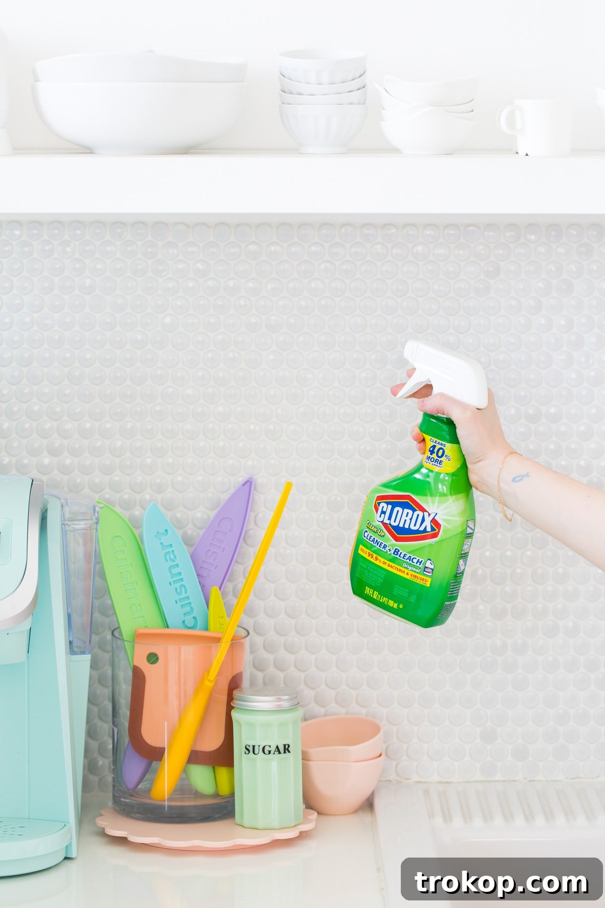 6 Unexpectedly Delightful Hacks for a Sparkling Spring Fridge 9 Kitchen floor grout being cleaned with Clorox Clean-Up