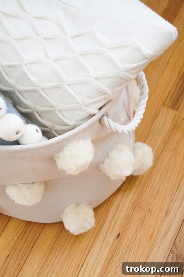 Craft Your Own Fluffy Pom Pom Storage Basket 14 The completed Fluffy DIY Pom Pom Bin, a stylish storage solution.