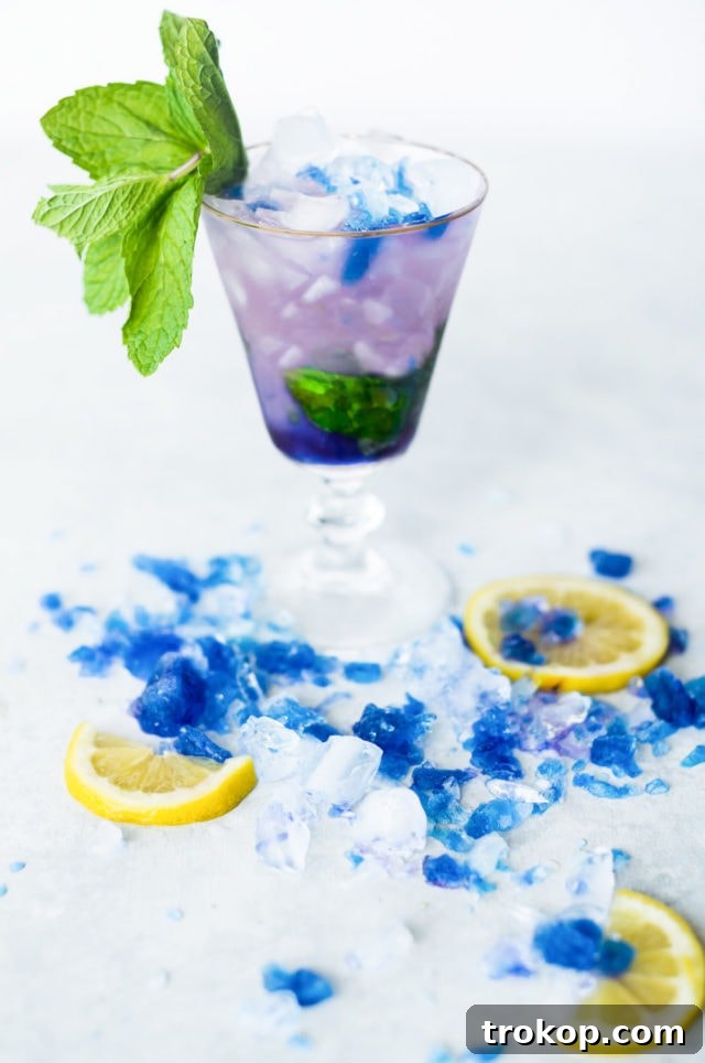 Magic Color-Changing Butterfly Pea Cocktails 7 photo of a mood ring color changing galaxy cocktail by top Houston lifestyle blogger Ashley Rose of Sugar & Cloth