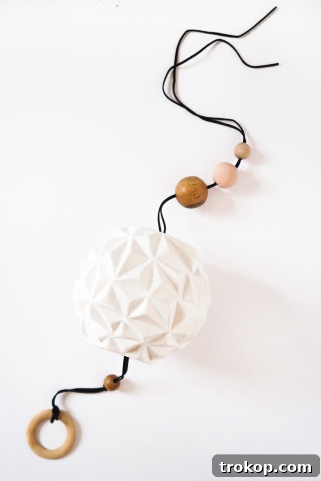 Step-by-step guide for threading cording and beads onto a DIY wind chime