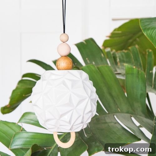 Palm leaf with a white vase wind chime in front