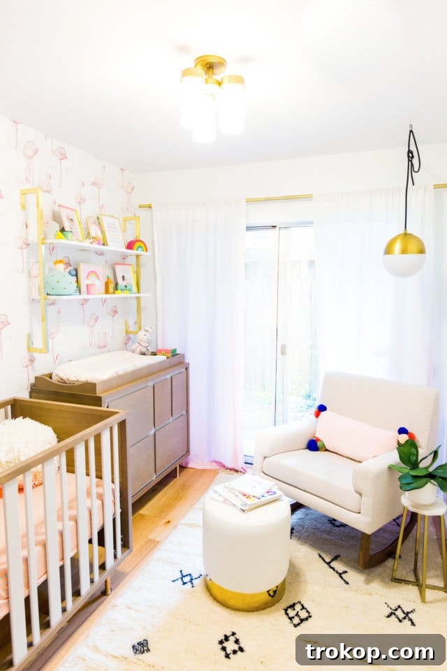 Little Sugar and Cloth Presents Gwen's Nursery Reveal 8 Close-up of Nursery Crib with Colorful Accents and Chic Design