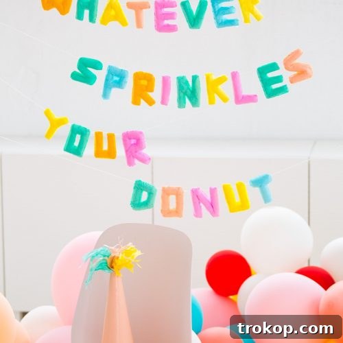 Photo of a finished faux balloon letter decoration garland by Sugar and Cloth