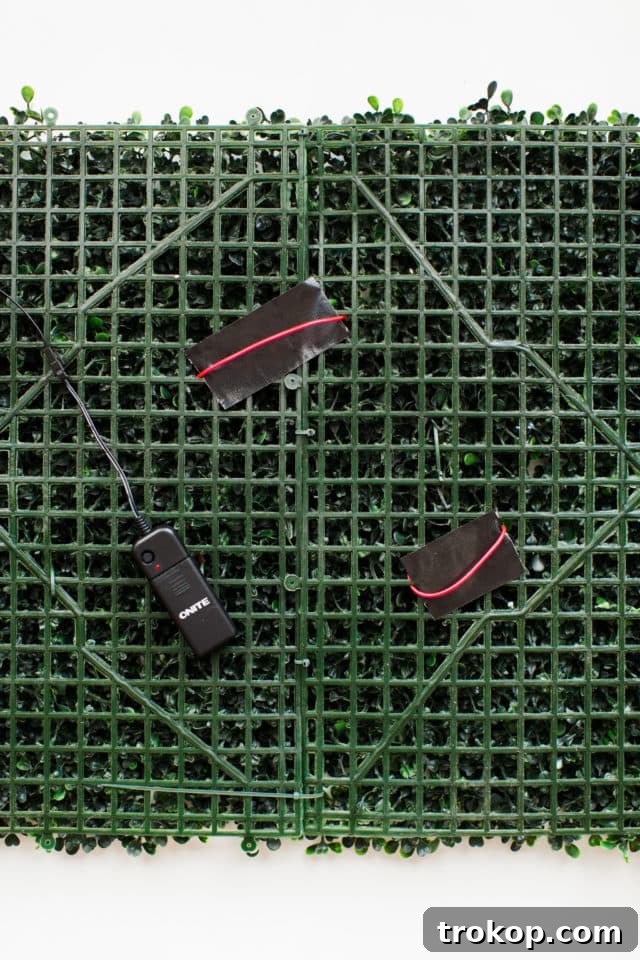 Lush Greenery Meets Neon Radiance 13 Concealing connecting wires for neon sign