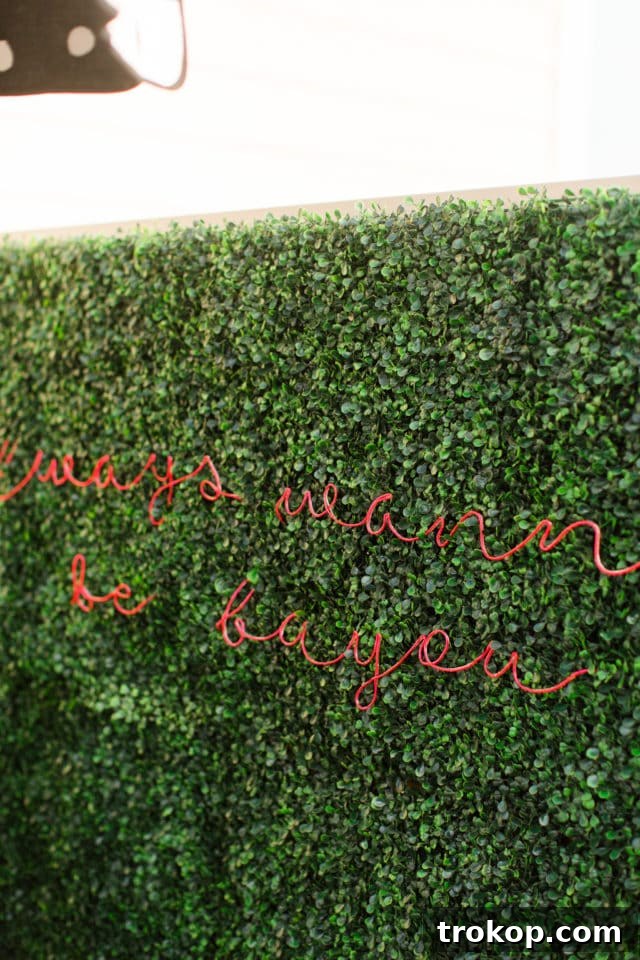 Lush Greenery Meets Neon Radiance 21 Faux boxwood wall with custom neon sign for outdoor decor