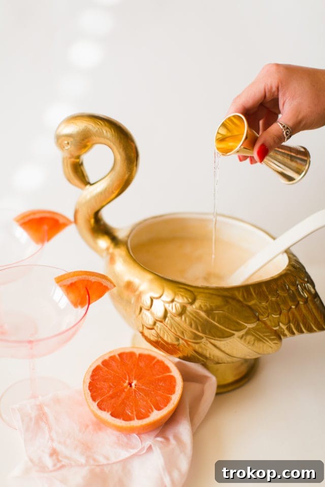 A selection of fresh citrus fruits and gin bottles, showcasing the key ingredients for the Immunity Boosting Gin Punch recipe.