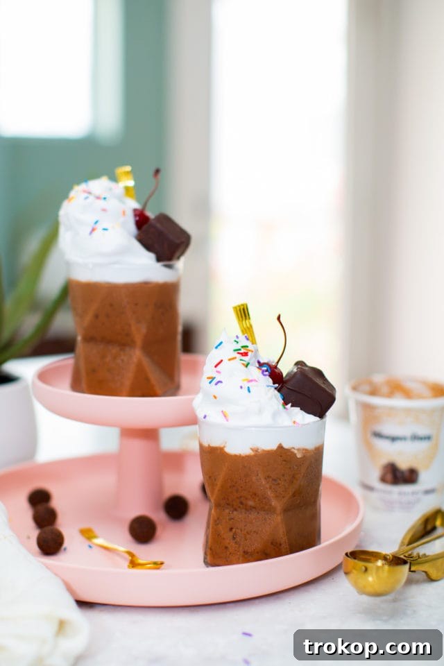 Top-down view of a Chocolate Salted Fudge Truffle Dairy-Free Milkshake with whipped cream and sprinkles