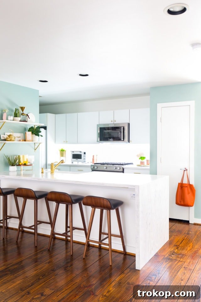 Modern White Kitchen: A wide shot showcasing the cohesive design, new appliances, and refreshed cabinetry.