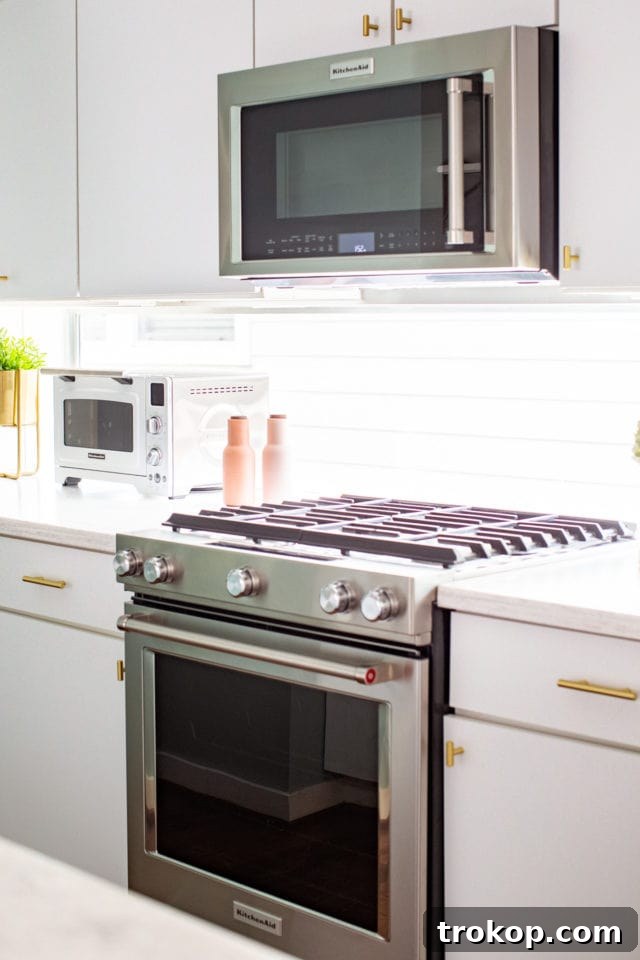 KitchenAid Gas Convection Range: A detailed view of the 5-burner stovetop and control panel.