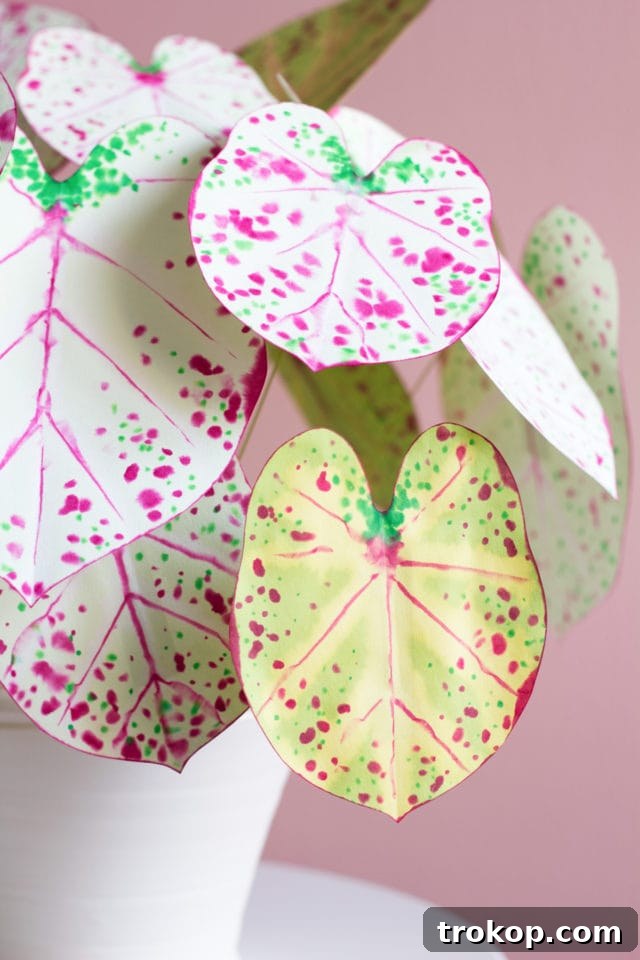 Artistic shot of a DIY paper caladium plant, highlighting its delicate paper leaves
