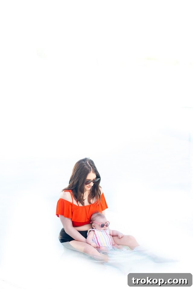 Stress-Free Baby Travel: Your 13-Item Packing Checklist 2 A mother and baby enjoying a beach vacation in Turks & Caicos, illustrating the joy of traveling with an infant.
