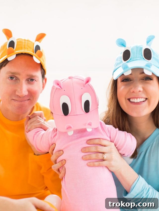 Our Handmade Hungry Hippo Crew 3 A candid shot of family members partially hidden by their colorful DIY Hungry Hungry Hippos costumes, with the question 'Can you tell who we're supposed to be?' playfully posed. The image highlights the distinctive and recognizable nature of the unique family Halloween costume, featuring the iconic game elements.