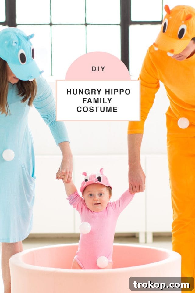 Our Handmade Hungry Hippo Crew 10 A charming image capturing the entire family in their coordinating DIY Hungry Hungry Hippos costumes, showcasing the success of their unique family Halloween costume idea. The photo radiates warmth and fun, perfect for inspiring others to create their own themed ensembles.