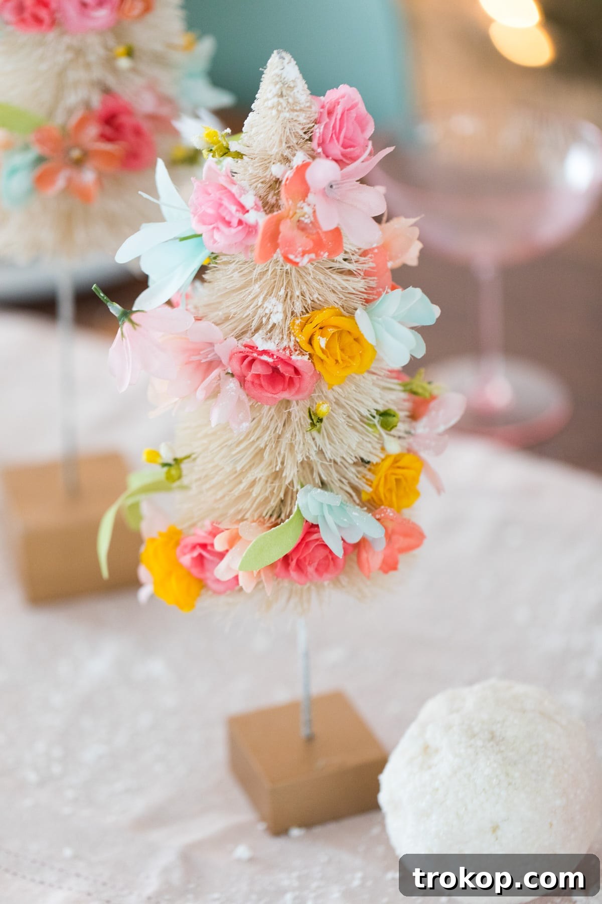 Charming DIY Floral Bottle Brush Christmas Table Decor 7 The finished faux flower bottle brush tree DIY centerpiece, ready to adorn any holiday table with its unique charm.