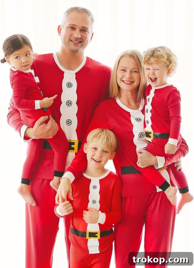 Festive Family Fun: Matching Family Christmas Pajamas 11 Family matching Santa Christmas pajamas featuring a graphic top with belt and red pants.
