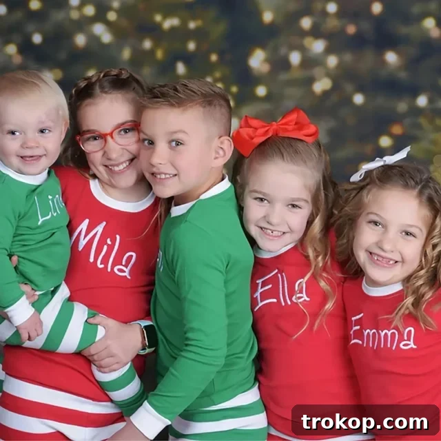 Festive Family Fun: Matching Family Christmas Pajamas 26 Personalized family Christmas pajamas with embroidered names on matching PJs.