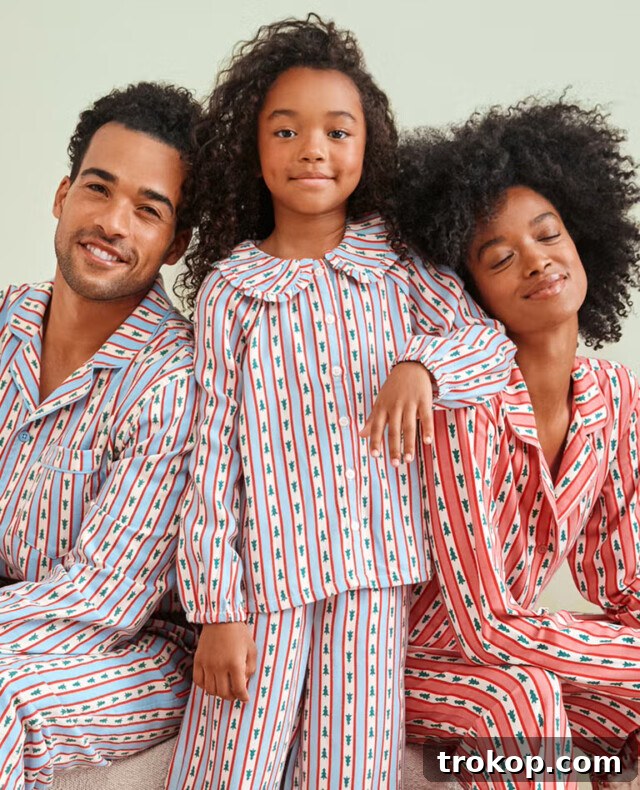 Festive Family Fun: Matching Family Christmas Pajamas 5 Family pajamas featuring a festive holiday tree ribbons design from Hanna Andersson.