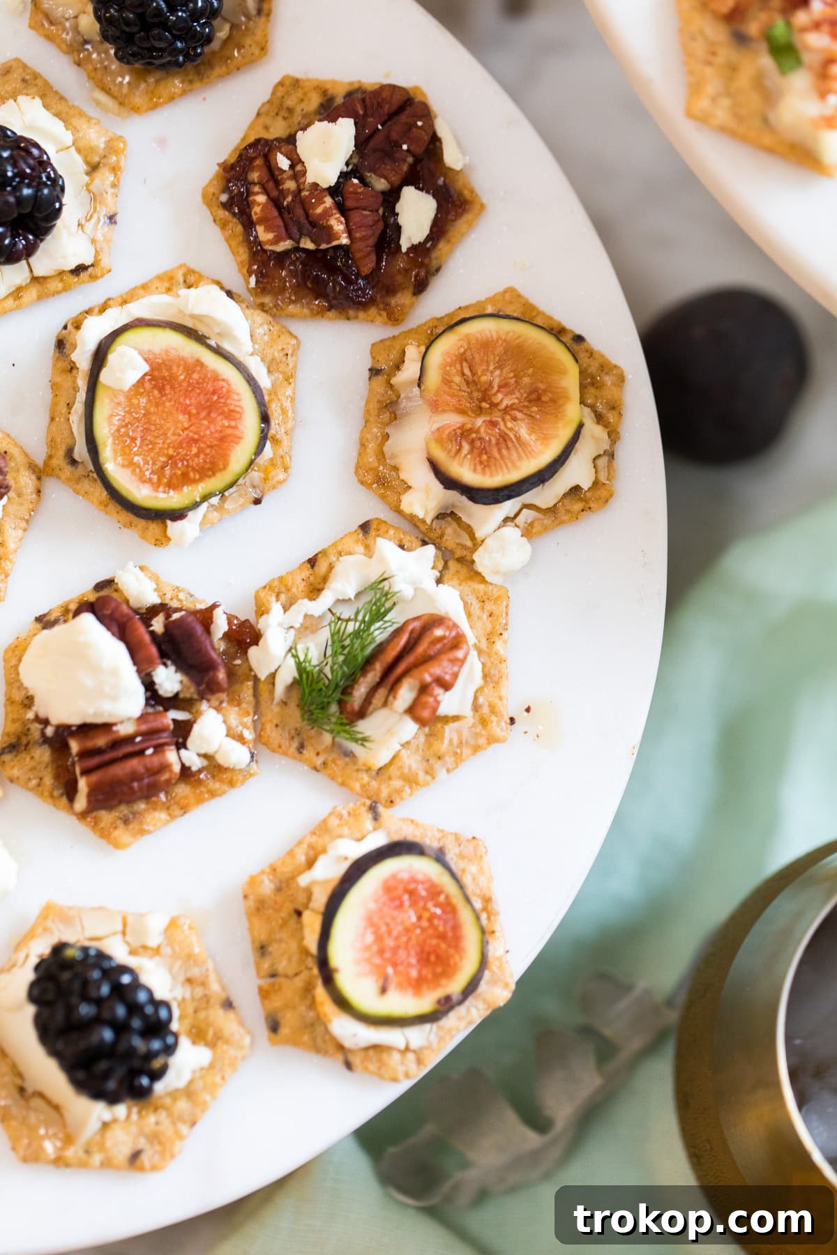 An overhead shot showcasing a variety of bruschetta recipe ideas, with different toppings arranged appealingly on crackers.