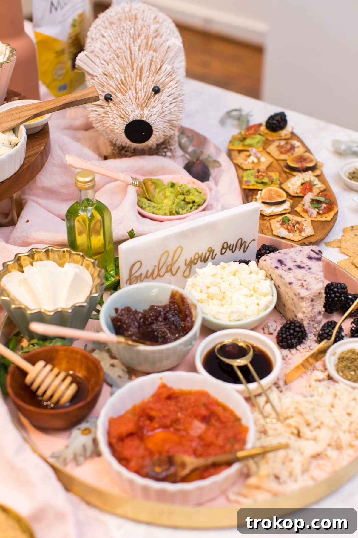 Charming "build your own" signs directing guests at an interactive bruschetta bar, enhancing the personalized experience.