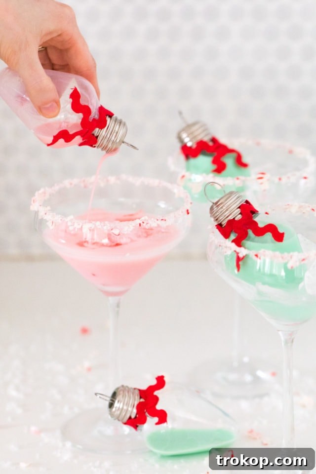 Homemade Holiday Cocktail Baubles 7 Close-up of clear Christmas cocktail ornaments with rumchata, a fun holiday drink idea.