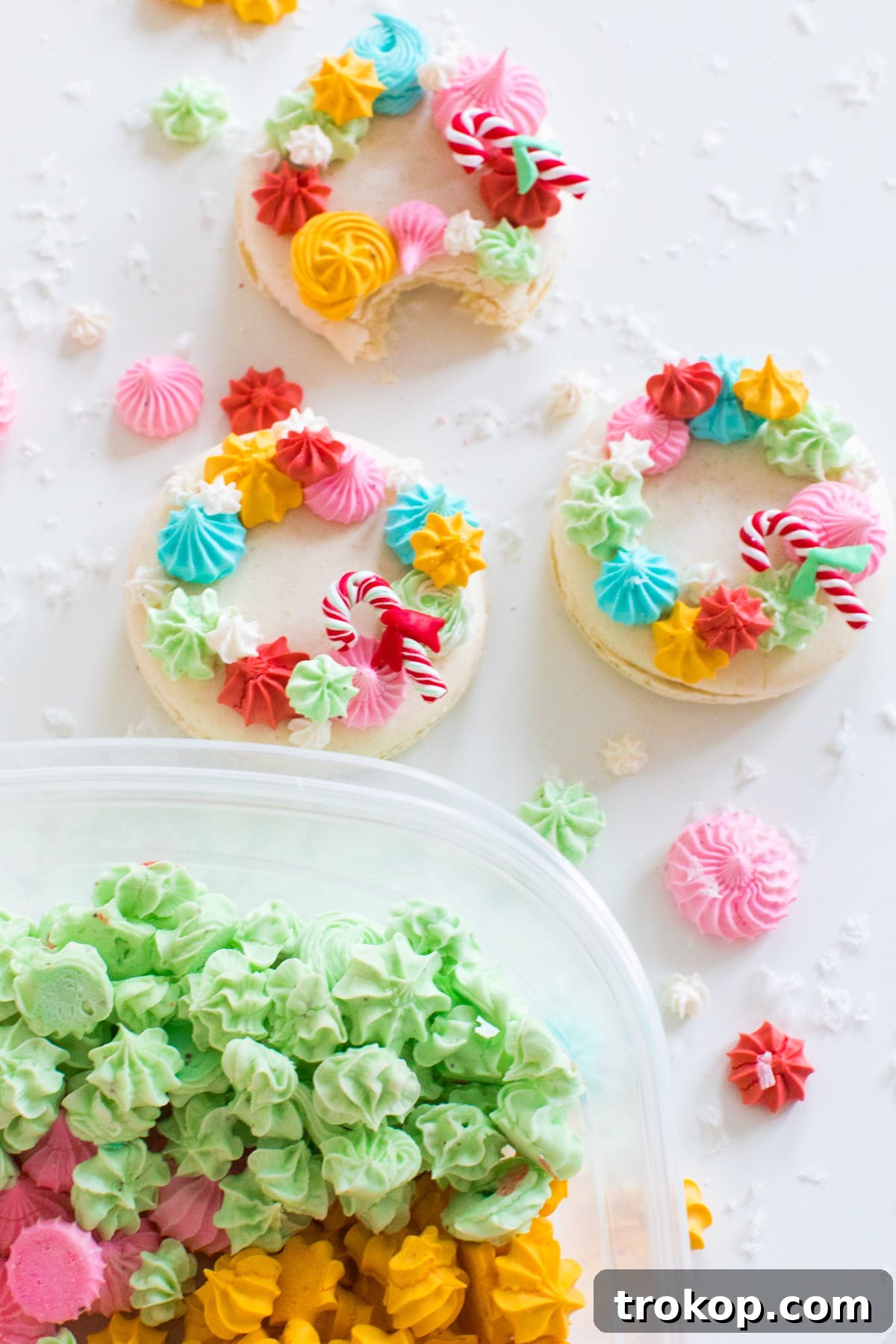 Festive Wreath Macaron Delights 2 topping macarons with meringues - How to Make Holiday Wreath Meringue Macarons by top Houston lifestyle blogger Ashley Rose of Sugar & Cloth #holiday #cookies #meringues #wreath #christmas #ideas