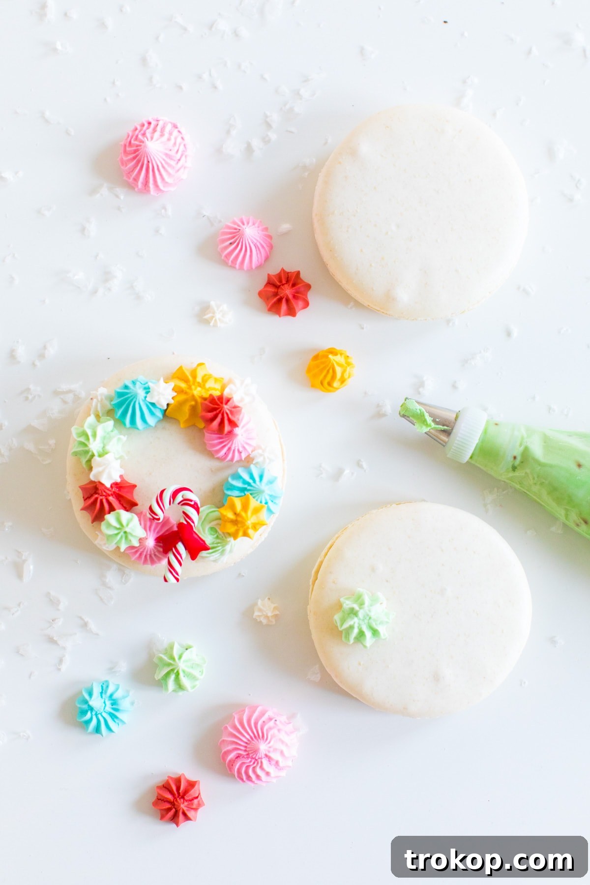 Festive Wreath Macaron Delights 4 piping meringues - How to Make Holiday Wreath Meringue Macarons by top Houston lifestyle blogger Ashley Rose of Sugar & Cloth #holiday #cookies #meringues #wreath #christmas #ideas