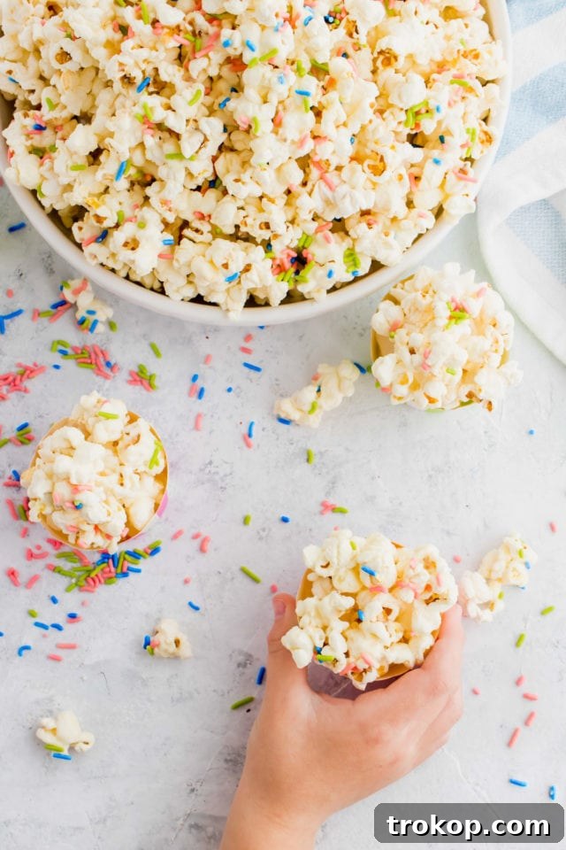 fun white chocolate funfetti popcorn by top Houston lifesyle blogger Ashley Rose of Sugar and Cloth #recipes #entertaining #idea 