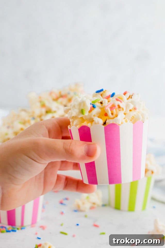 holiday white chocolate funfetti popcorn by top Houston lifesyle blogger Ashley Rose of Sugar and Cloth #recipes #entertaining #idea 