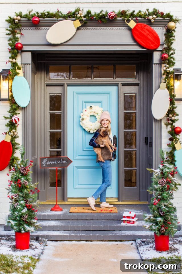 Festive front door decorated with jumbo DIY Christmas lights garland