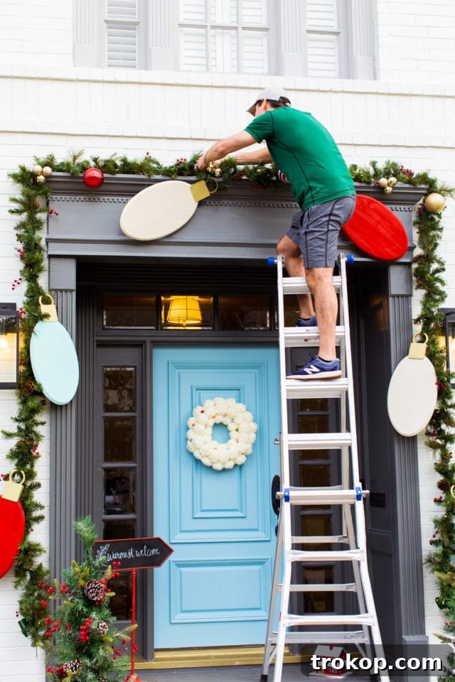 Reinforcing the DIY jumbo Christmas light bulbs with screws for durability