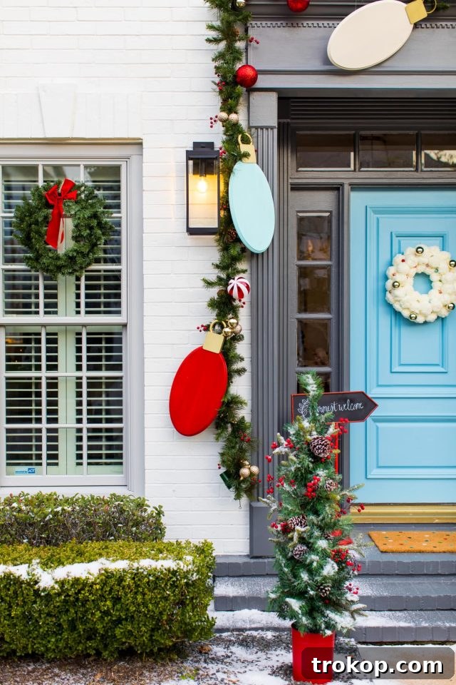 Beautiful front entrance adorned with a DIY jumbo Christmas light garland