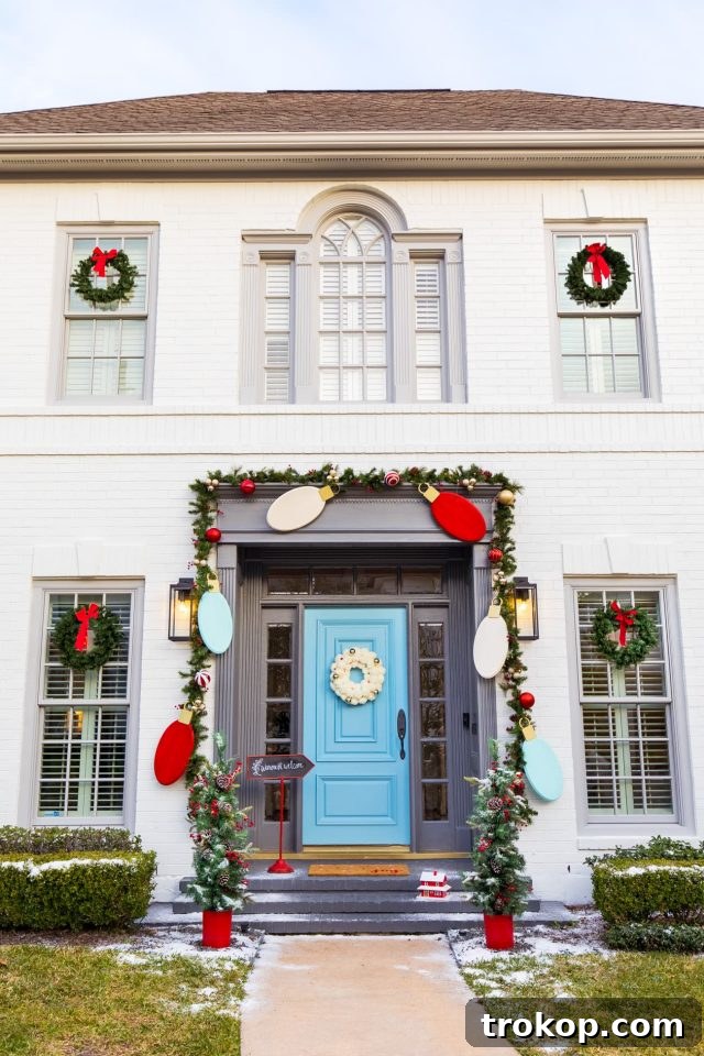Charming house exterior with creative DIY Christmas front door decor