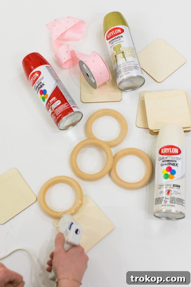 Assembling the wooden light bulb tops with glue