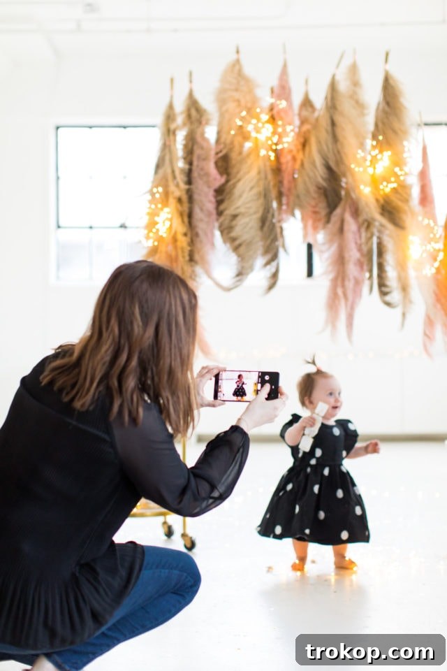 Snapping photos of the completed Pampas Grass DIY Photo Backdrop