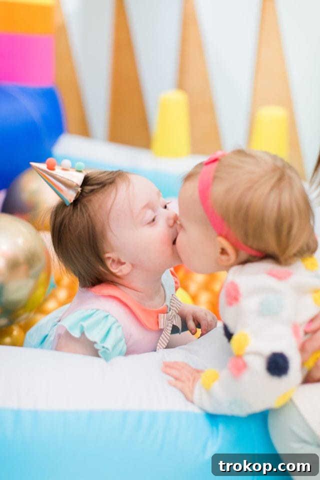 Gwen and a friend enjoying the first birthday party festivities
