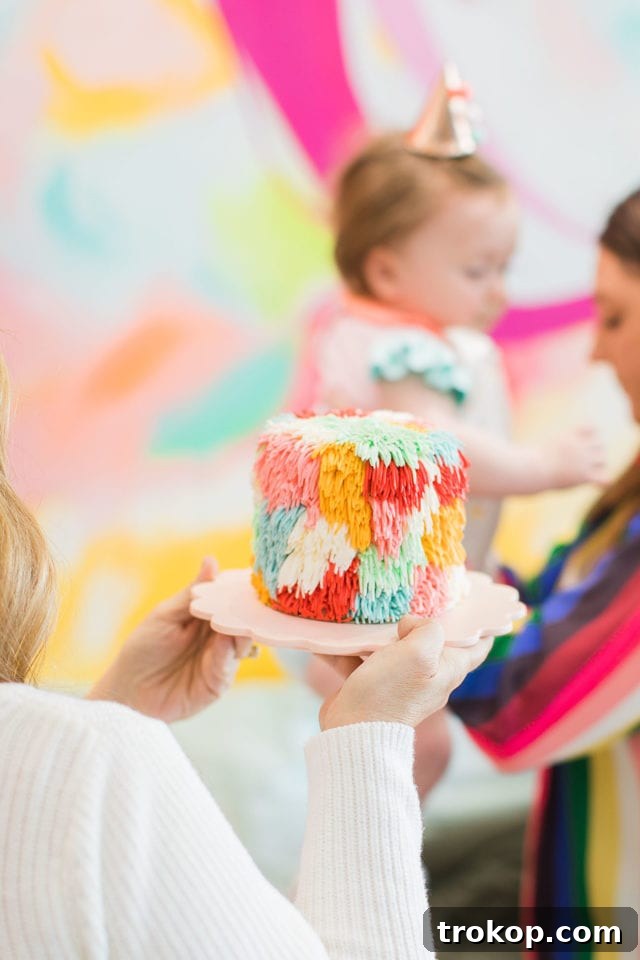 Gwen's smash cake from Whisk Bakery, featured at her first birthday party by Sugar & Cloth