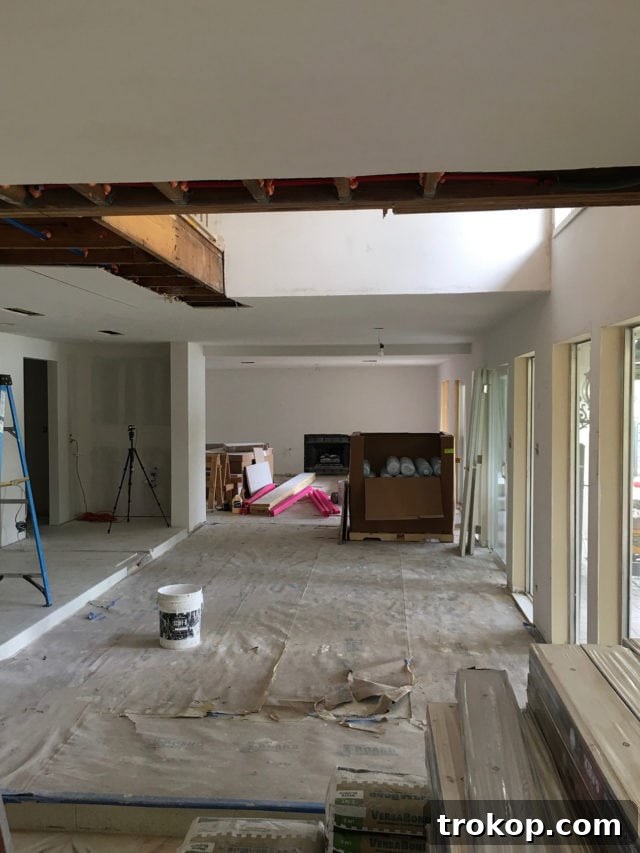 The newly opened space after the removal of the old spiral staircase, highlighting improved light and flow.
