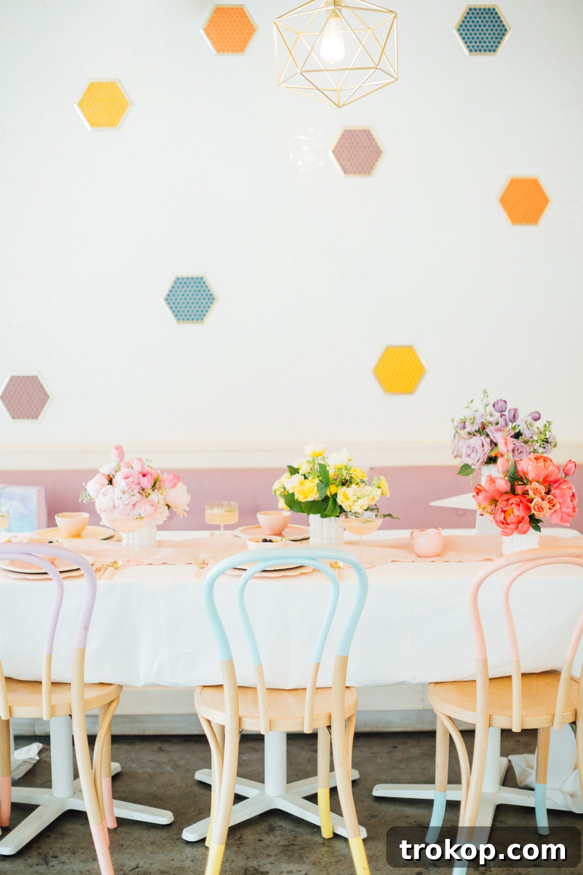 Colorblock pastel chairs and a beautifully set table for Easter brunch at Melange Creperie