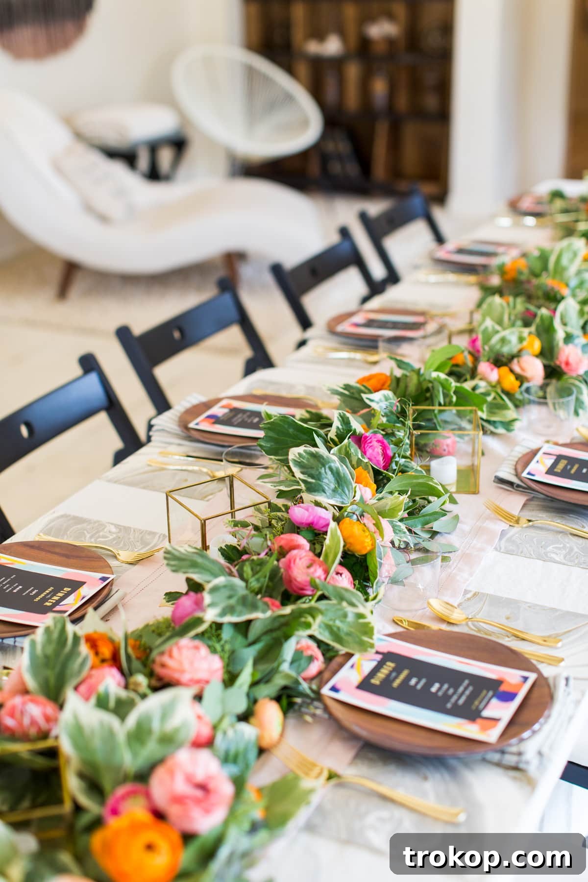 A beautifully styled farmhouse dinner tablescape at The Vintage Round Top, featuring rustic decor, floral arrangements, and elegant place settings, captured during a blogger retreat by Ashley Rose of Sugar & Cloth.
