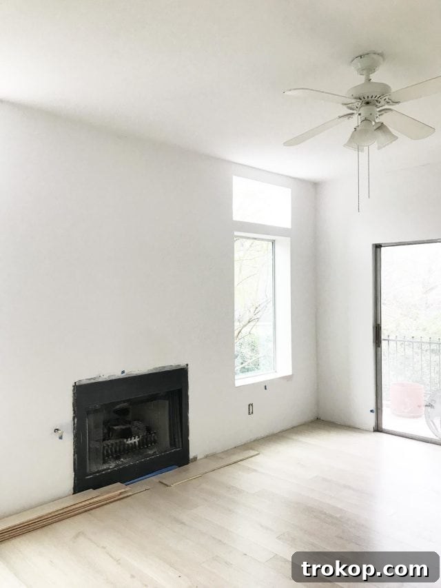 Unveiling My New Studio and Craft Nook 2 Bright and airy home studio space with a minimalist design, featuring large windows and pristine wood floors, ideal for creative photoshoots. The room promises a good view and abundant natural light.