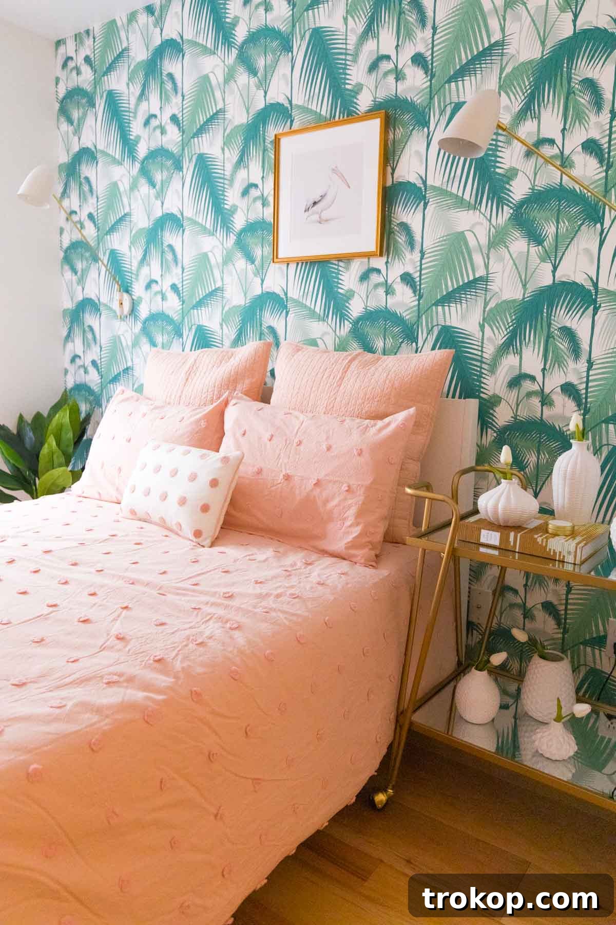 Guest bedroom refreshed for home staging - Image 2: Stylish gold bar cart and bright bedding