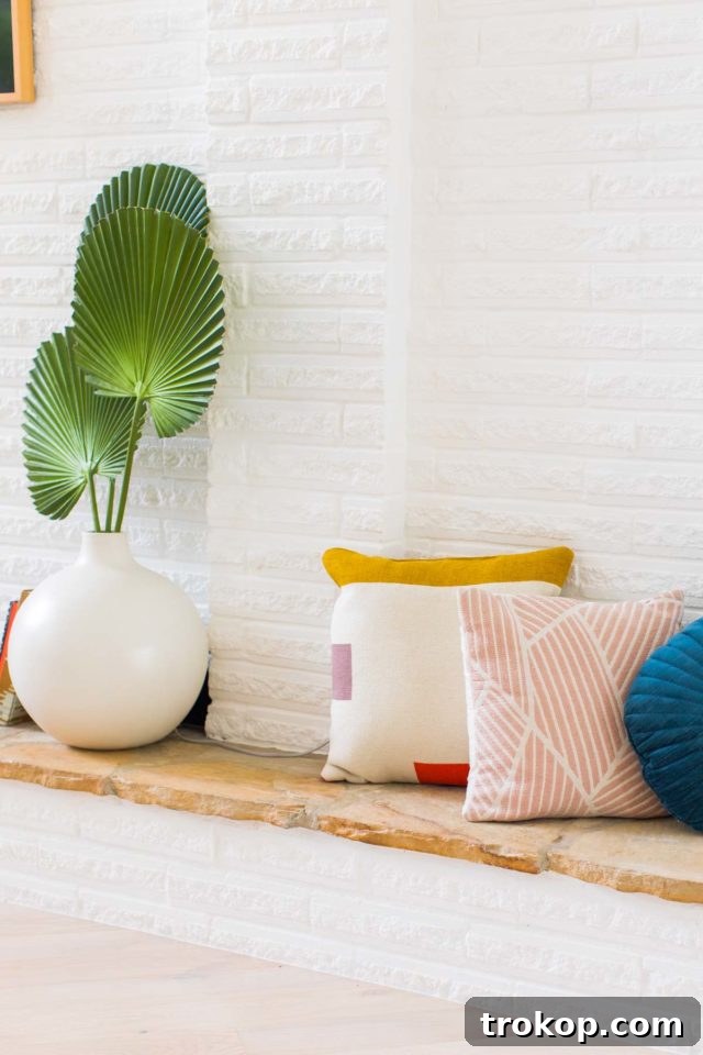 Stylish mid-century modern living room with a focus on comfortable seating and strategic placement of plants to enhance the vibrant interior design.