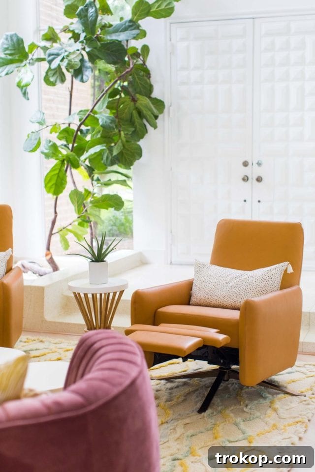 View of the rattan bench strategically placed between the living and dining areas, adorned with pillows and a round gold mirror, creating a cozy transition zone.