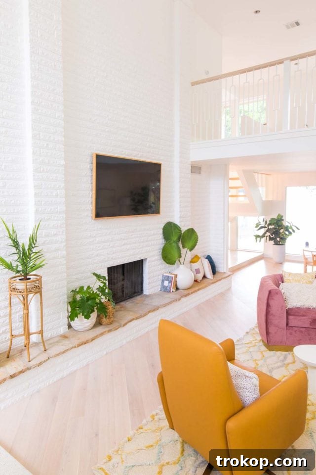 Gallery wall featuring four vibrant Minted art prints, adding color and modern abstract design above the credenza in the living room.