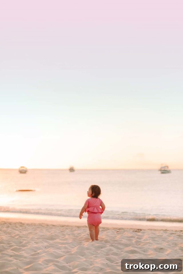 Smooth Skies with Baby: Your Essential Travel Document Checklist 3 infant wearing pink swimming suit - do children need id to fly