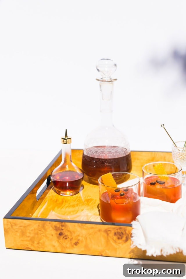 A beautifully garnished Coffee Old Fashioned cocktail, ready to be enjoyed.