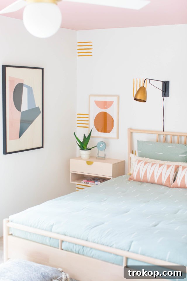 Stunning golden yellow accent wall with a minimal line pattern in a freshly renovated guest bedroom.